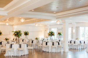 Empty Historic Estate Ballroom Set up for Reception with Centerpieces