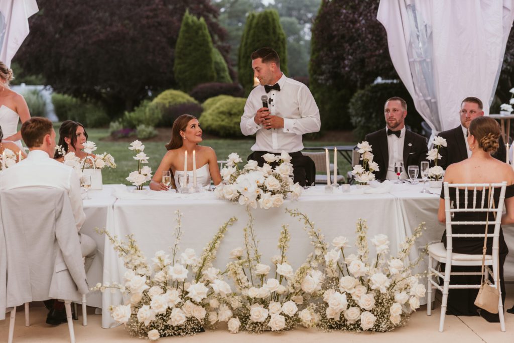 Bride and Groom Looking at Each Other Toasting Reception