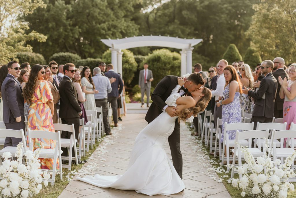 Groom Dips Bride In Aisle After Ceremony