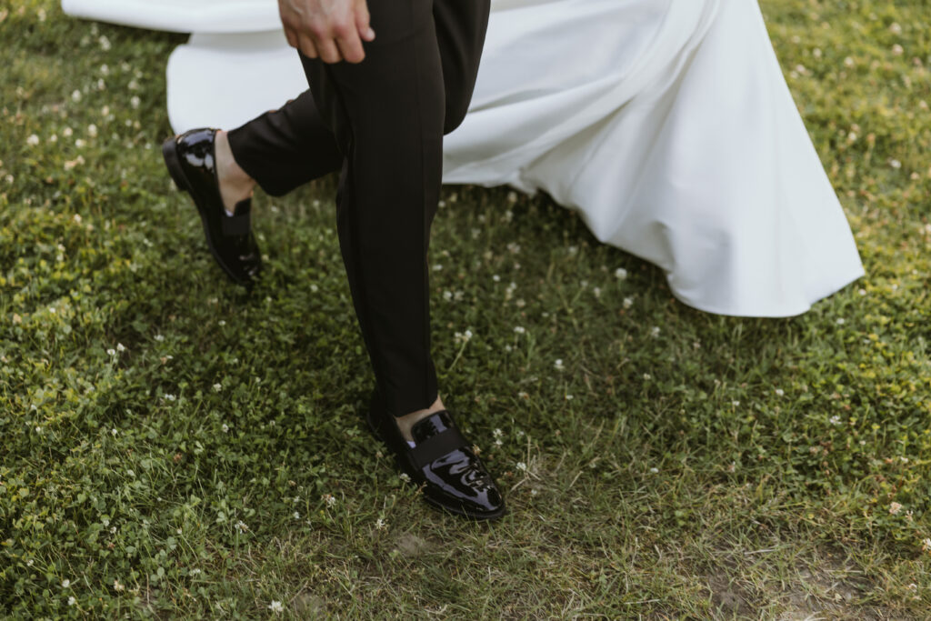 Groom Shoes and Bride Train Walking on Grass