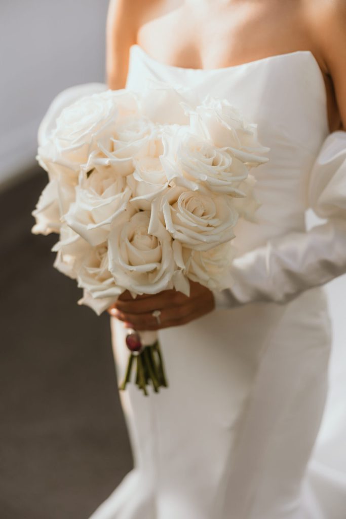 Bride Holding Bouquet White Roses