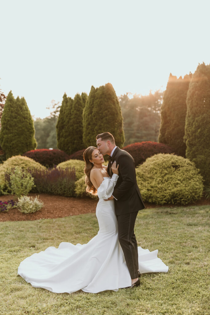 Bride and Groom Embrace Laughing Golden Hour Portrait