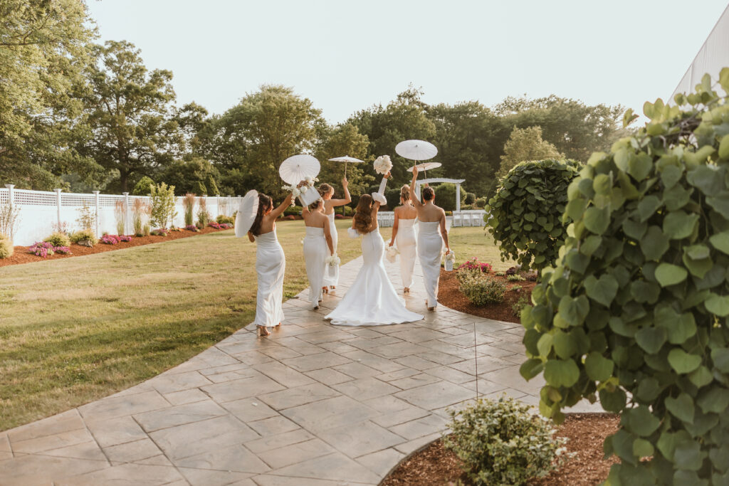 Bride and Bridal Party Walking to Ceremony With Parasols