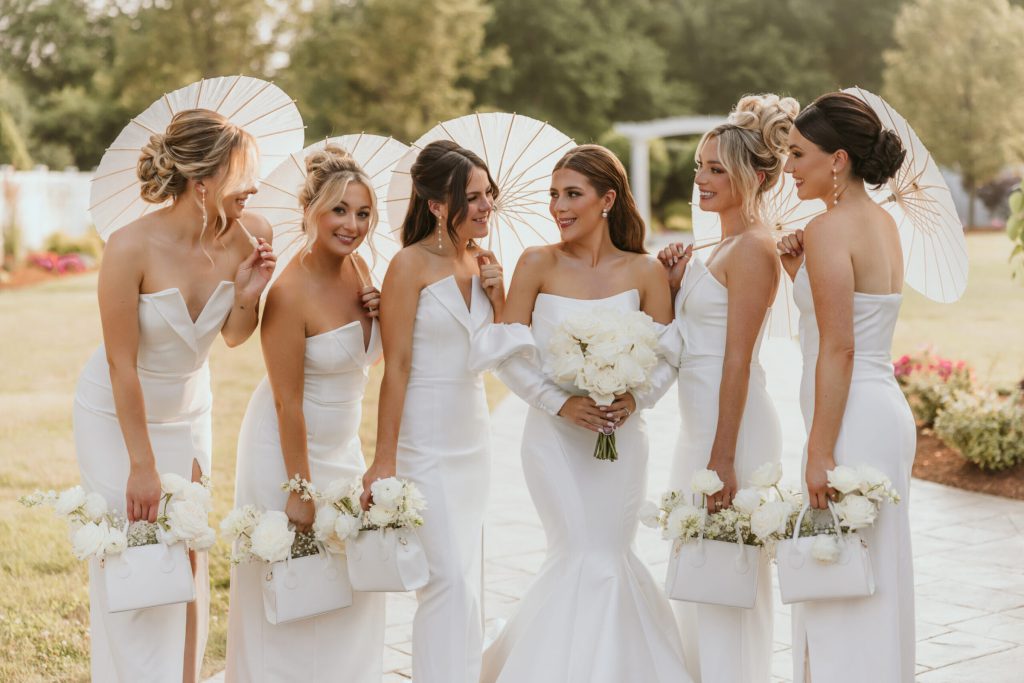 Bride and Bridal Party White Gowns Parasols Purse Bouquets