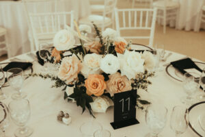 Neutral Florals Rose Next To Black Table Numbers 