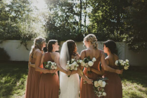 Birde and Bridesmaids From Behind Dark and Moody Portrait