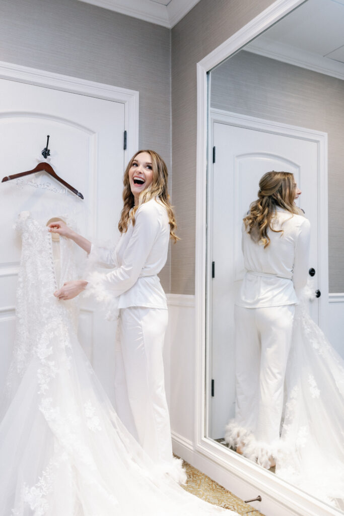 Bride Getting Ready Laughing Holding Dress