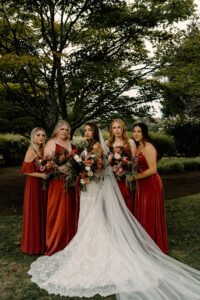 Bride and Bridesmaids in Red Outdoor Dark and Moody Portrait