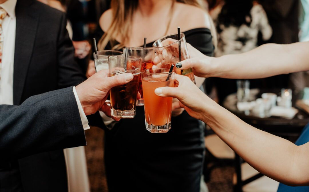Guests Toasting With Fall Wedding Cocktails
