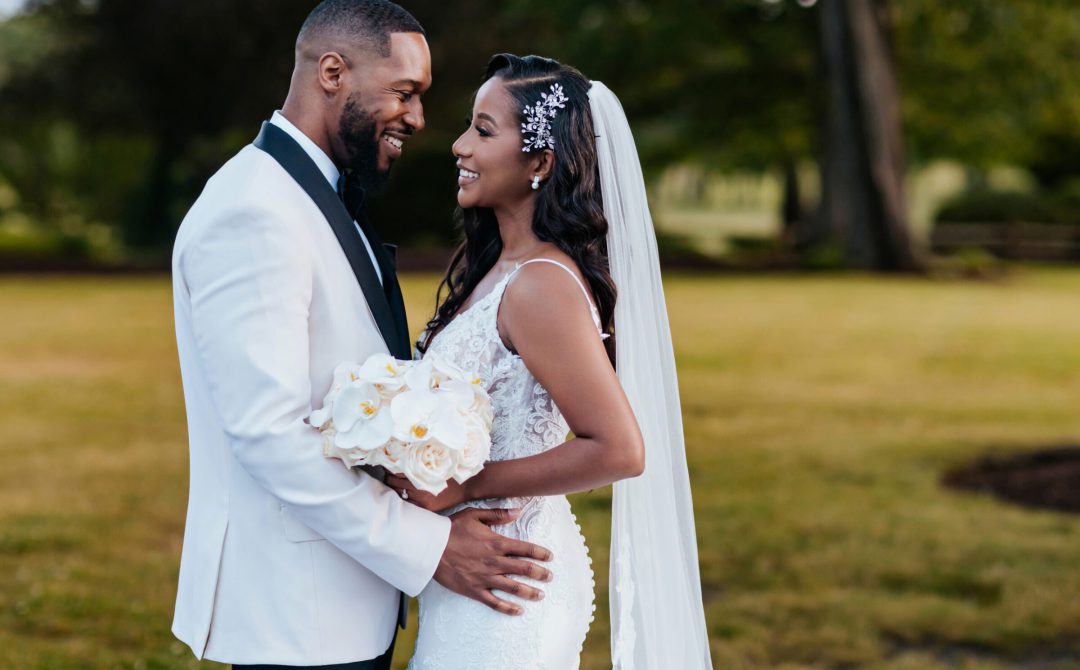 Bride and Groom Portrait Outside Smiling at Each Other