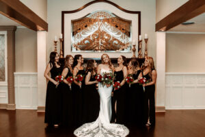 Bride and Bridesmaids Black Dresses in Front of Fireplace 