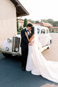 Bride and Groom Portrait in Front of White Vintage Rolls Royce