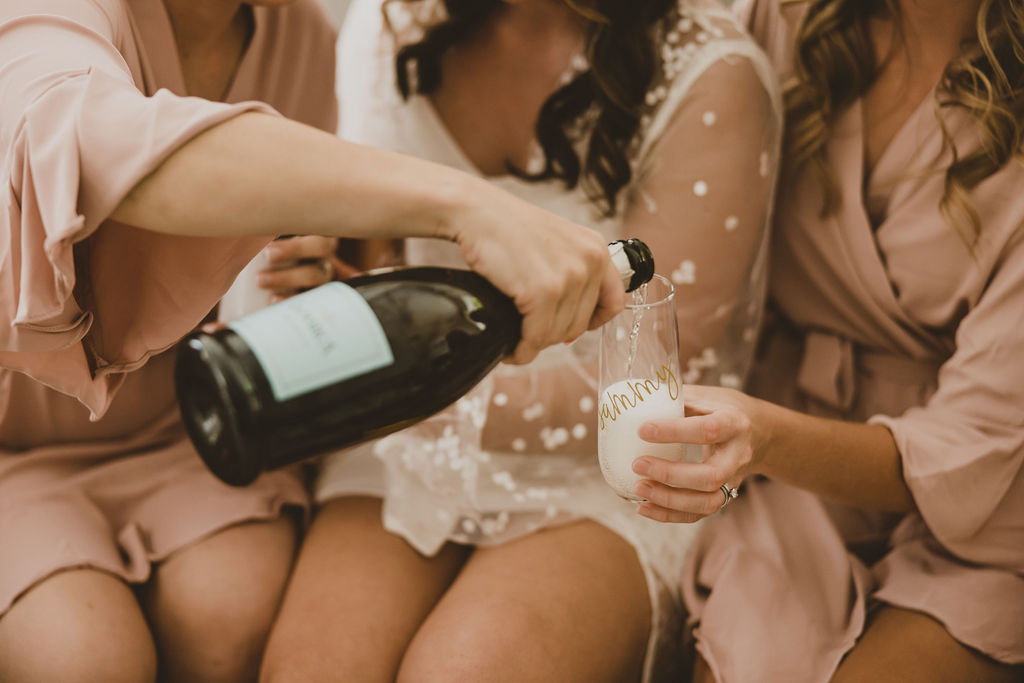 Bridal party drinking favorite fall wedding cocktail champagne