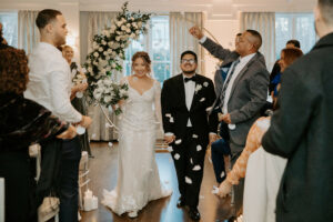 Bride and Groom Recessional Petal Toss Indoor Ceremony at Saphire Estate 