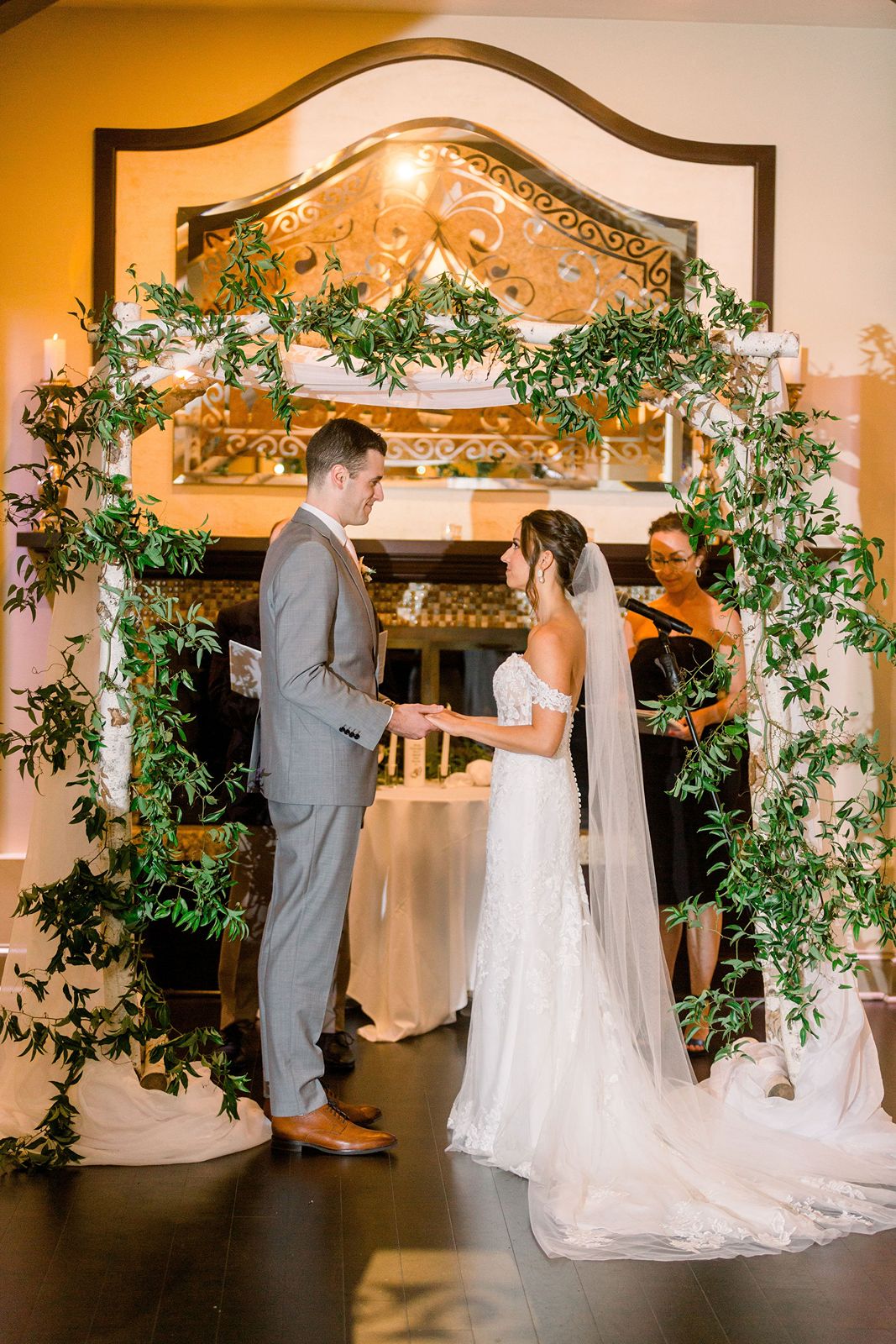 Indoor Wedding Ceremony under Greenery in Madera Ballroom 