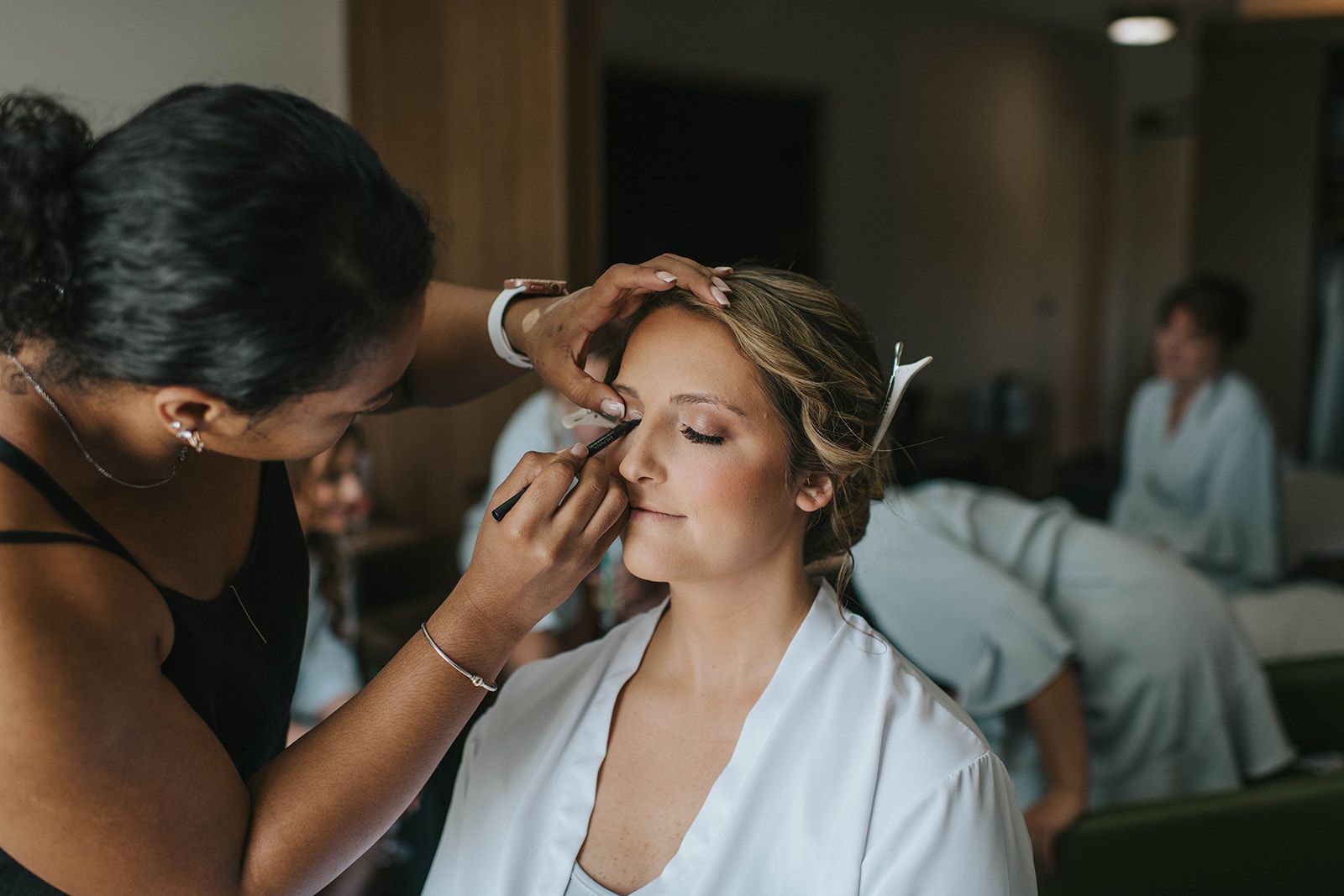 Bride Getting Makeup Done by Wedding Makeup Artists