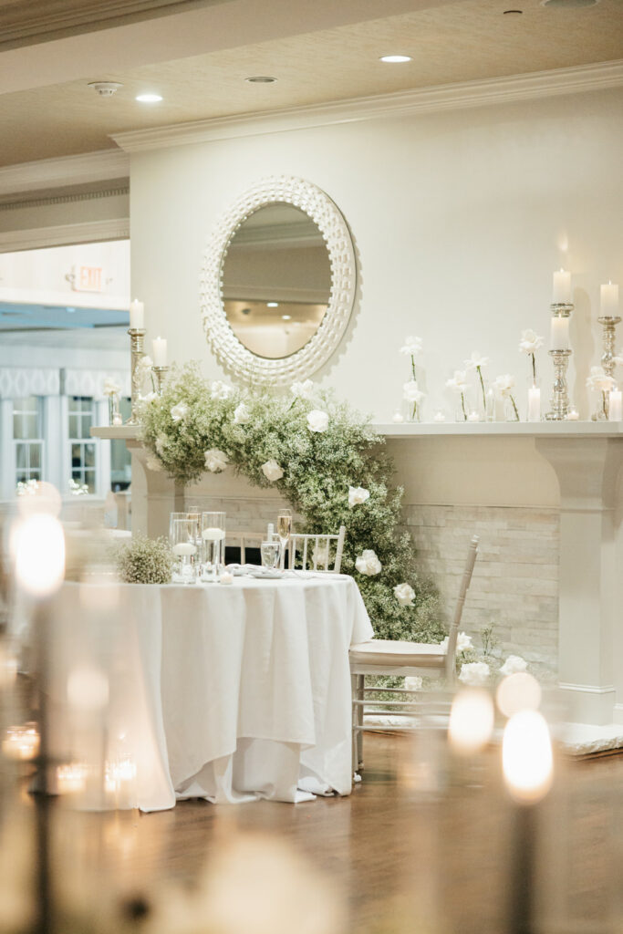 candles and greenery mantle decor
