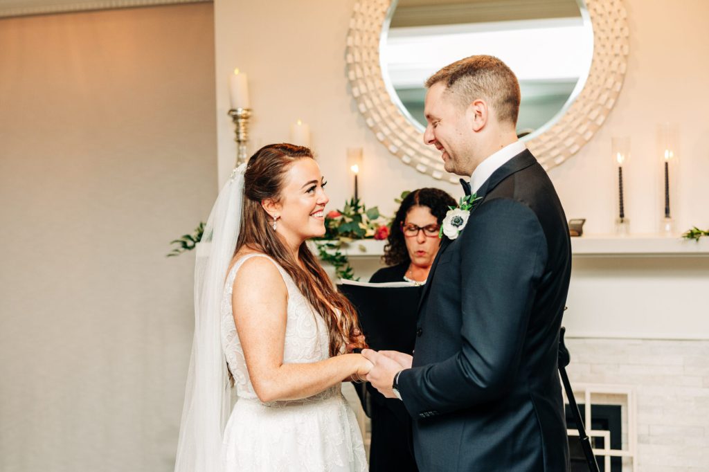 Bride and groom Holding Hands Indoor Ceremony at Saphire Estate