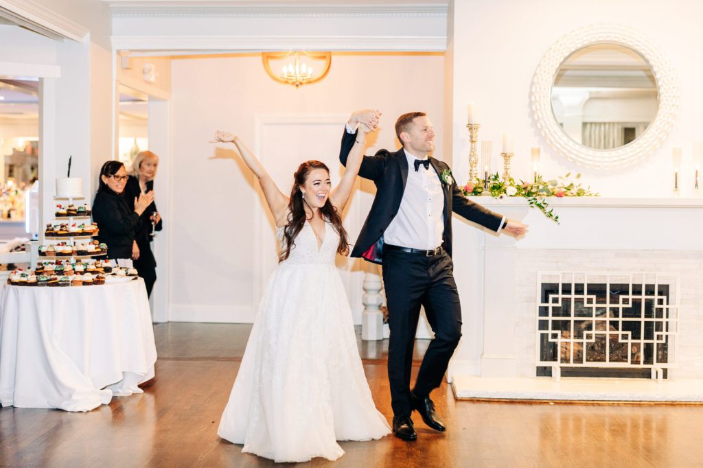 Bride and Groom Reception Entrance Hands Up Excited