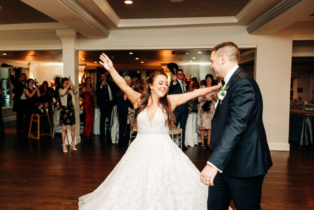 Bride and Groom Twirling During First Dance at Saphire Estate