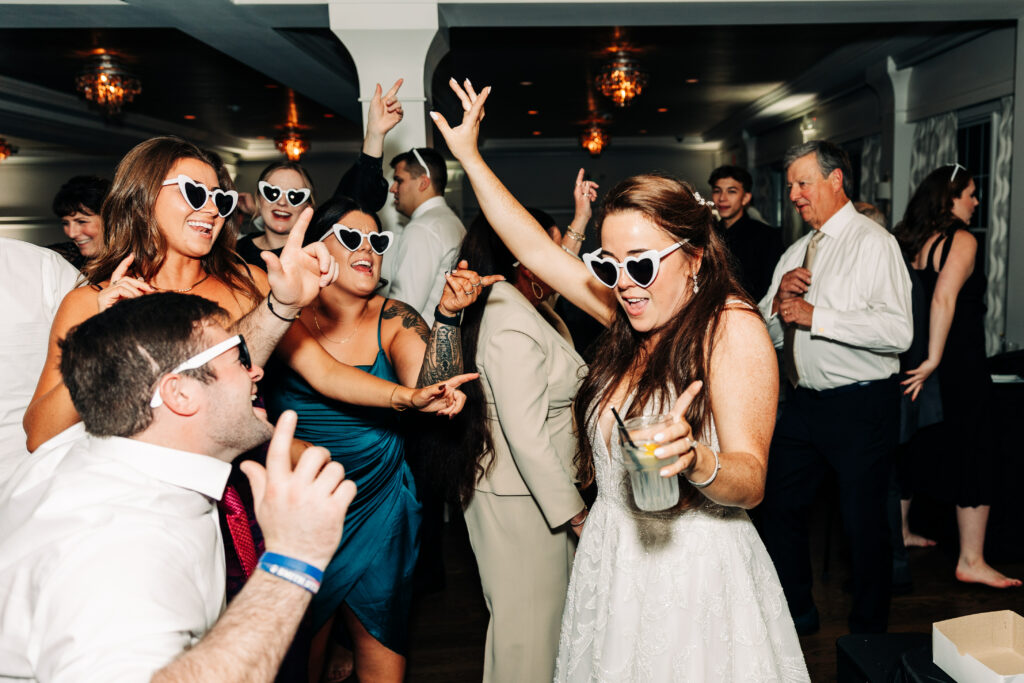 Bride Wearing Sunglasses Dancing at Wedding Reception