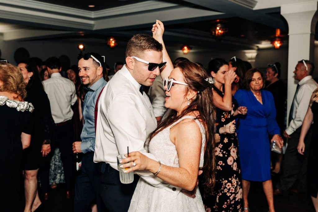 Bride and Groom Wearing Sunglasses at Wedding Reception