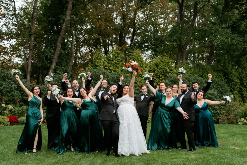 Wedding Party Hands Up Outside October Wedding at Avenir