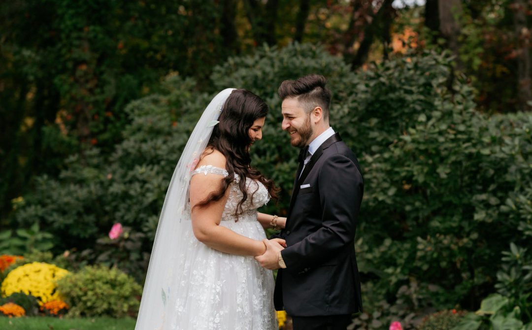Bride and Groom outside Laughing October Wedding