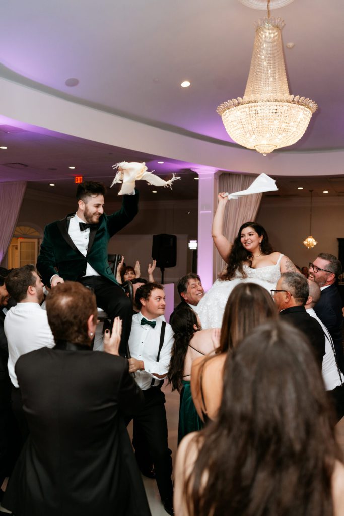 Bride andGroom Lifted in Ballroom at Avenir