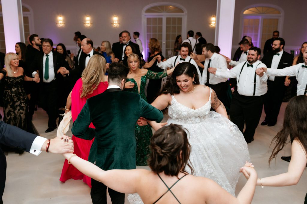 Bride and Groom Arm in Arm at reception Dancing