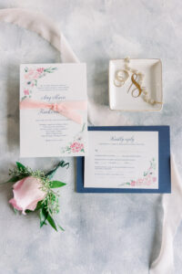 Pink and Blue Wedding Details Flat Lay