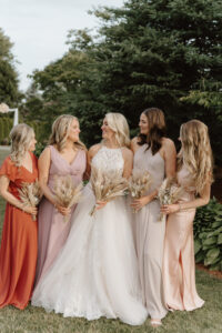 Bride and Bridesmaids Outside Mismatched Dresses