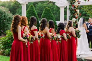 Bridesmaids at Wedding Ceremony Wearing Red Dresses