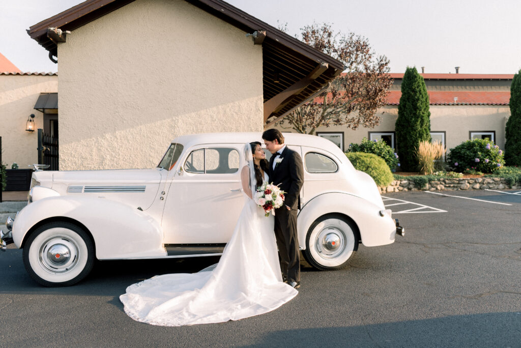 Bride and Groom With Vintage Car
