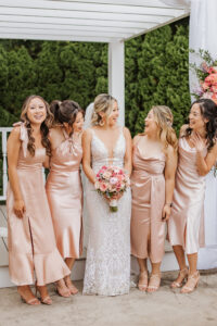 Bride and Bridesmaids Outside Laughing Rose Gold Color Palette