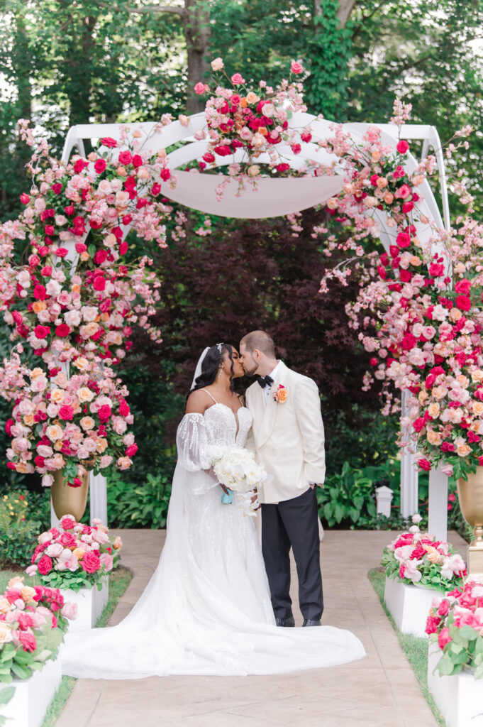 pink wedding florals outdoor ceremony