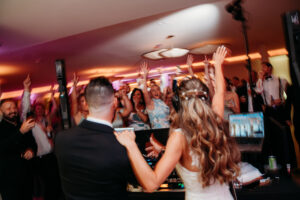 Wedding reception welcome party before a wedding at The Lakehouse, a stunning lakeside venue in Halifax, MA. Guests enjoying scenic views, elegant decor, and festive atmosphere by the water, kicking off a memorable wedding weekend.