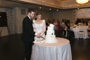 Bride and groom cake cutting at all-inclusive wedding reception