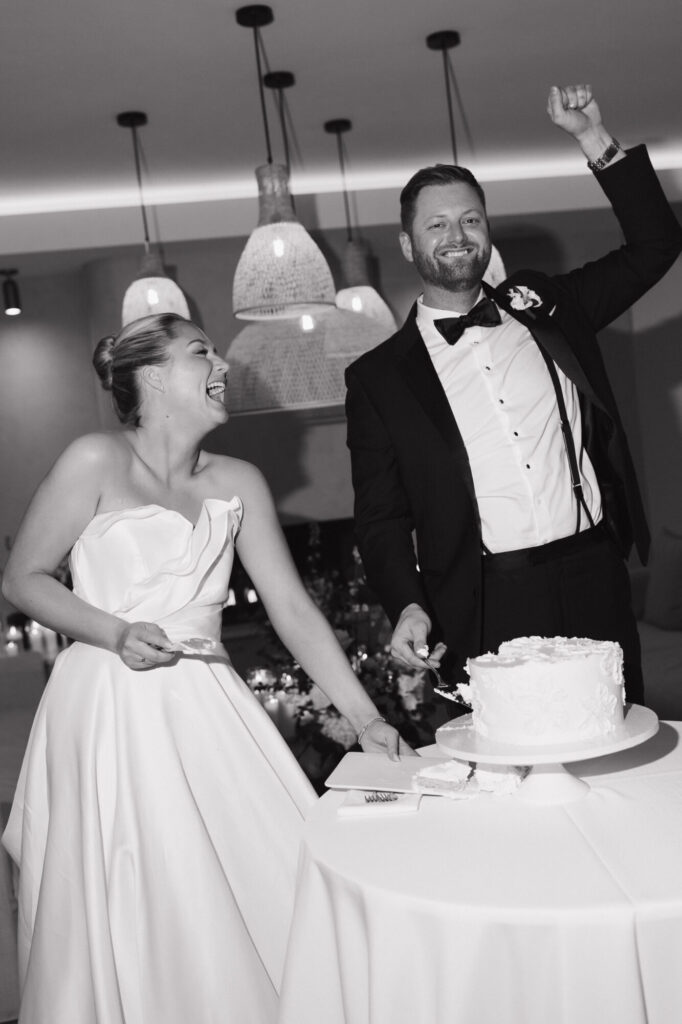 Bride and groom cut their cake