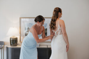 Bride getting ready at The Gatehouse at Saphire Estate with bridesmaid